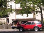 two red suvs and a matt in back 
by robert kershaw